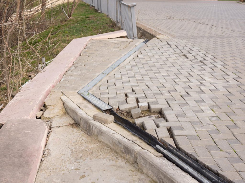 unfinished concrete brick road